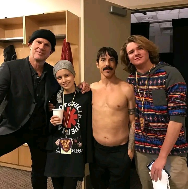 This is Maggie, a young Red Hot Chili Peppers fan battling cancer whose favorite song was Dosed. She asked Josh Klinghoffer to play it—and the band did. She passed away shortly afterward.
